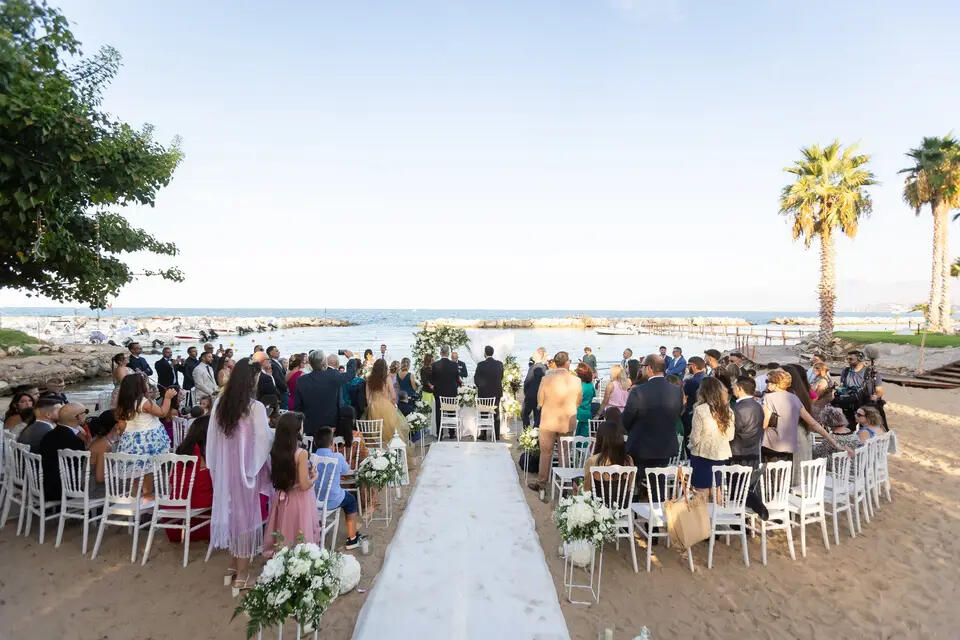 Palm Beach, Casteldaccia A ceremony beside the sea at Palm Beach, Casteldaccia, palms above the guests